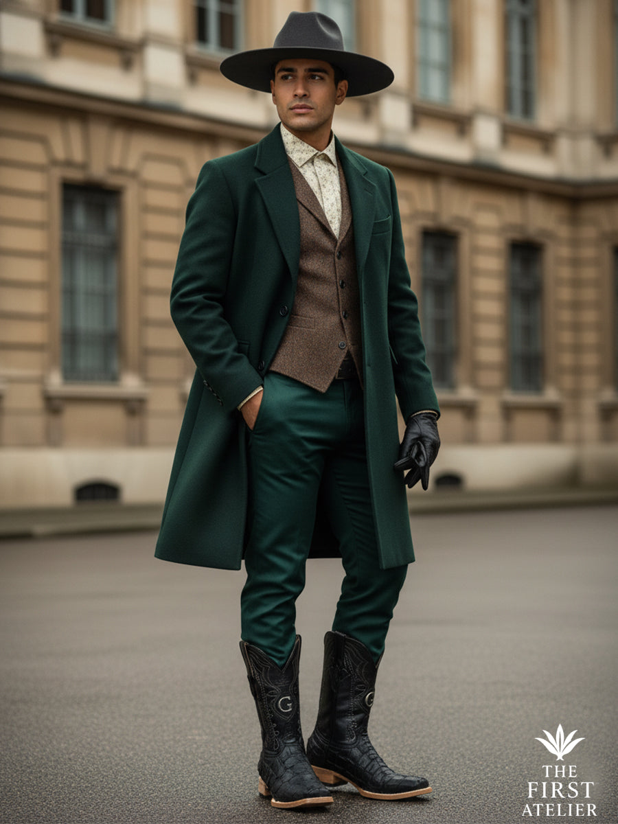 Man walking through the city wearing tailored outerwear and the El Tránsito Boot in black pirarucu (monster fish) leather, expressing modern western elegance, control, and movement within an urban setting, The First Atelier, Atelier No. 36.
