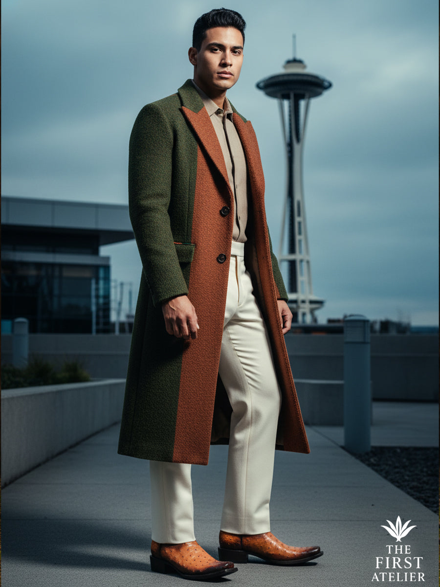Man standing in a modern city setting wearing The First Atelier Atelier No. 48 men’s western boots in cognac ostrich leather — clean silhouette, architectural balance, and contemporary refinement grounded in craft.
