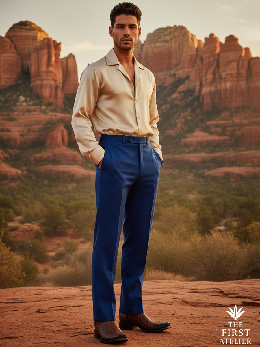 Man wearing The First Atelier Atelier No. 49 brown ostrich leather western boots, standing in an open landscape with relaxed tailoring — a balance of freedom, structure, and refined western craftsmanship.
