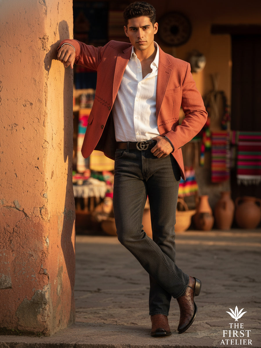 Man wearing The First Atelier Atelier No. 49 brown ostrich leather western boots, styled with a relaxed tailored outfit against a warm urban backdrop — effortless confidence where craftsmanship meets everyday sophistication.
