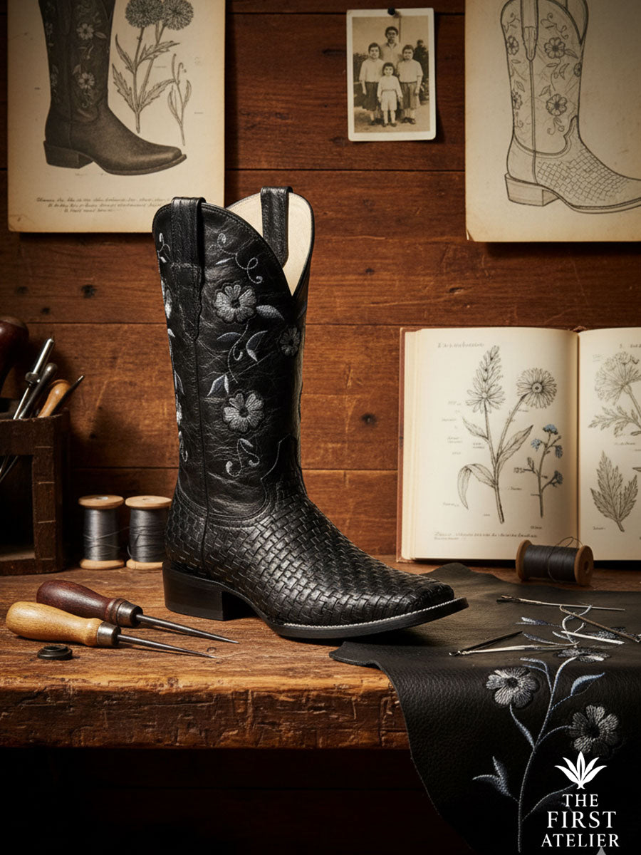 Side profile of Atelier No. 11 La Rosa de Plata boot, showcasing the intricate silver floral embroidery and woven leather texture.