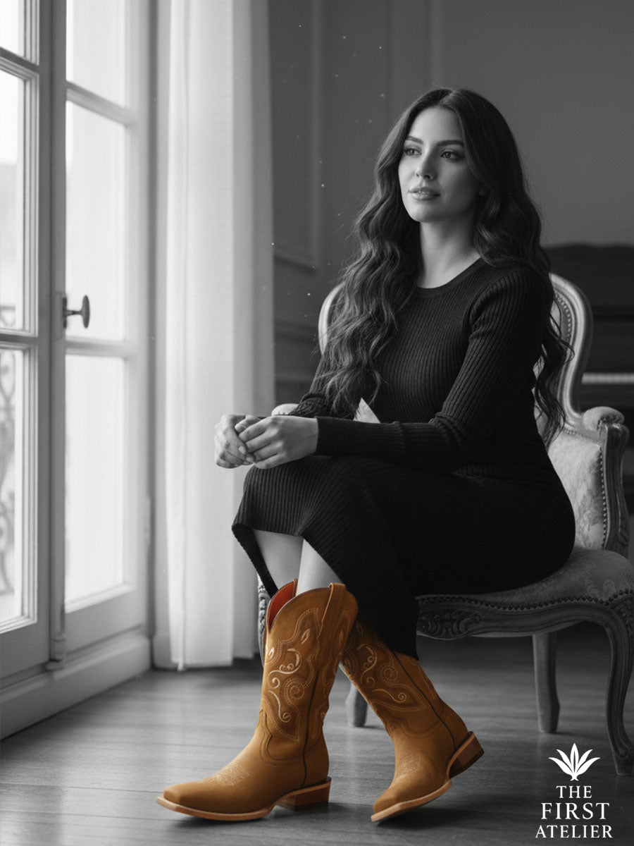 Black-and-white portrait where only the Gilded Saffron Boots remain in tan color; scroll embroidery emphasized