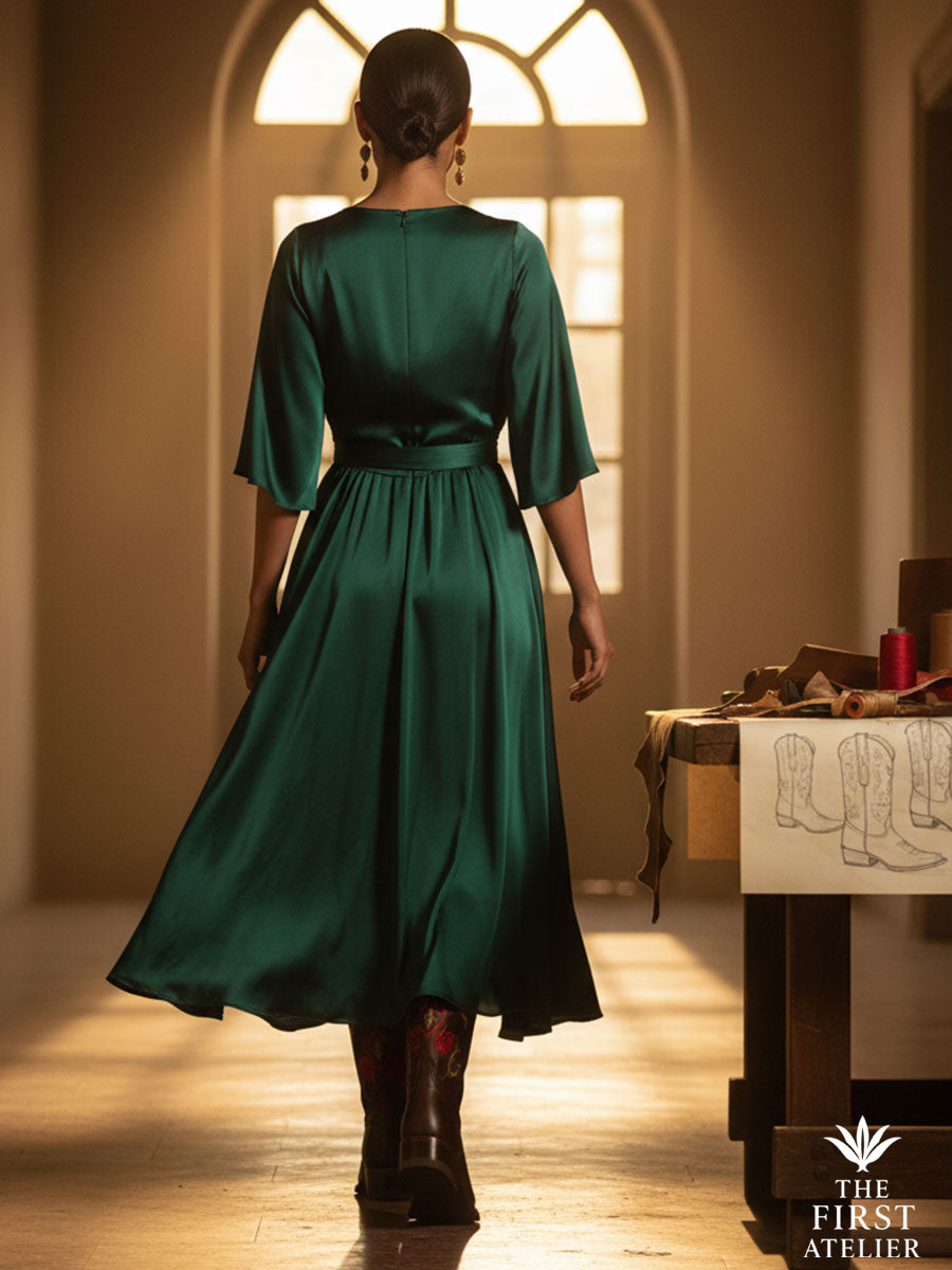 Rear view of the Rosewood Whisper Boot as the model walks through an elegant hallway bathed in golden light, symbolizing timeless elegance