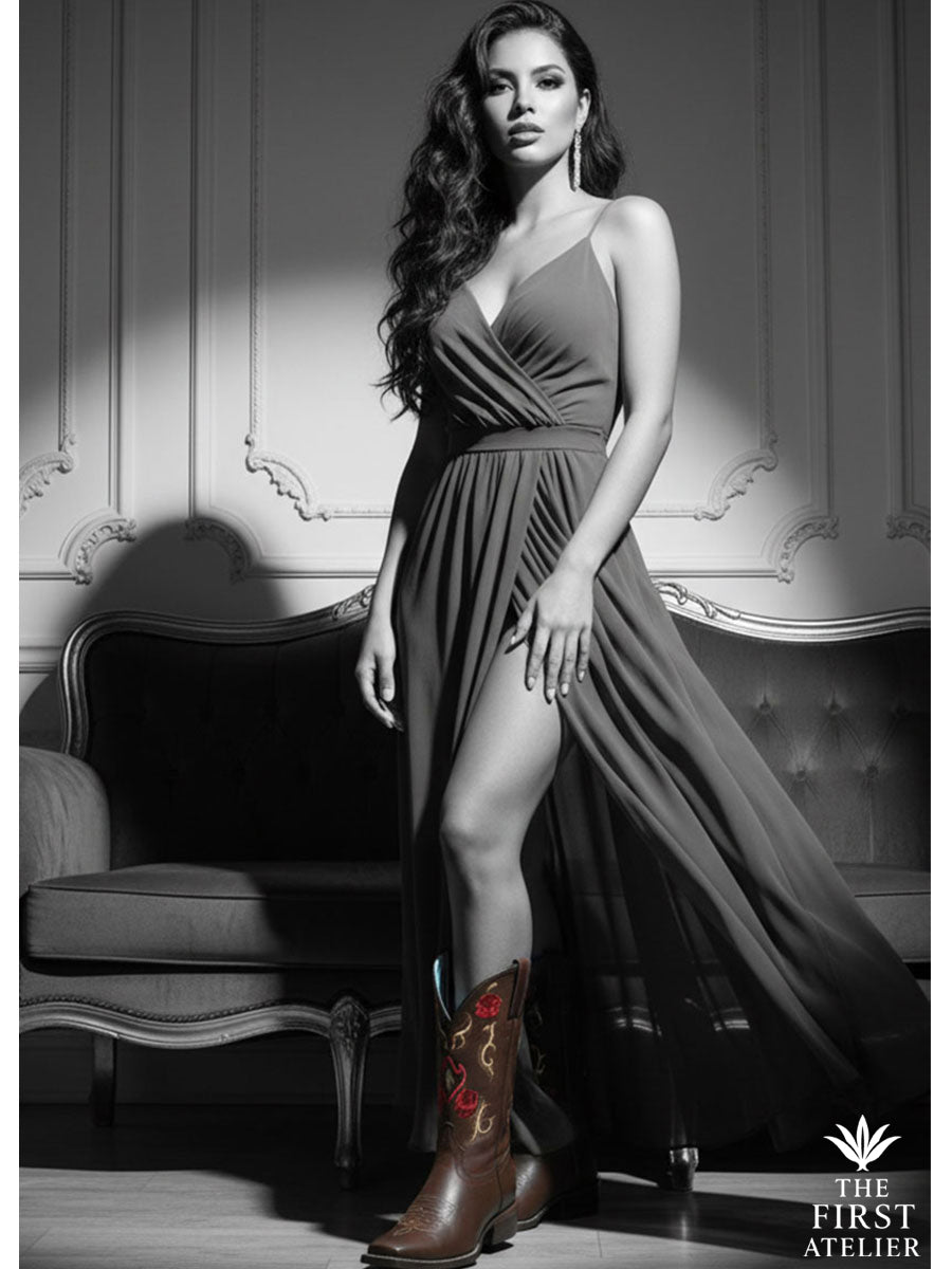 The Rosewood Whisper Boot displayed in a craftsman’s studio surrounded by sketches, tools, and a single rose — representing artistry, passion, and heritage.