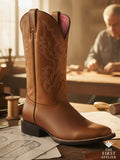 Thunder born boot in honey-cognac leather on an artisan’s bench; lightning-inspired stitching under warm atelier light, tools and sketches around